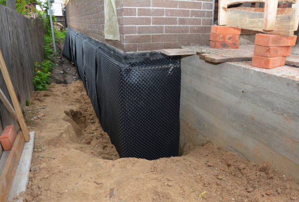 Happy homeowners after waterproofing job in Niagara University
